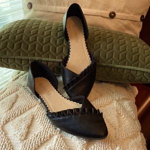 Restricted black flats.  Size 8.